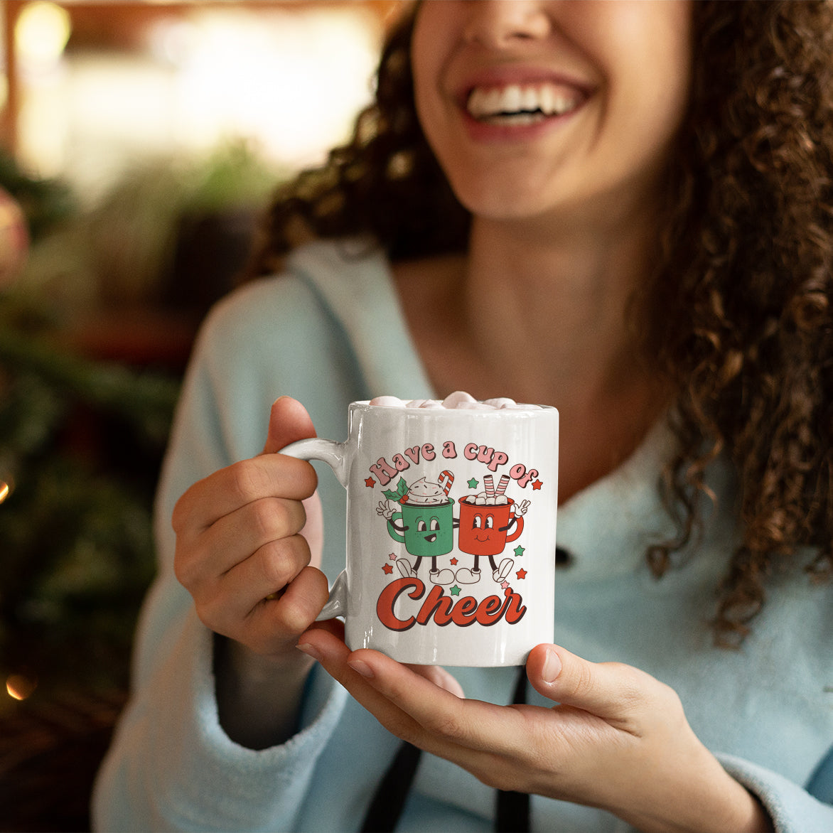 a woman holding a coffee mug in her hands