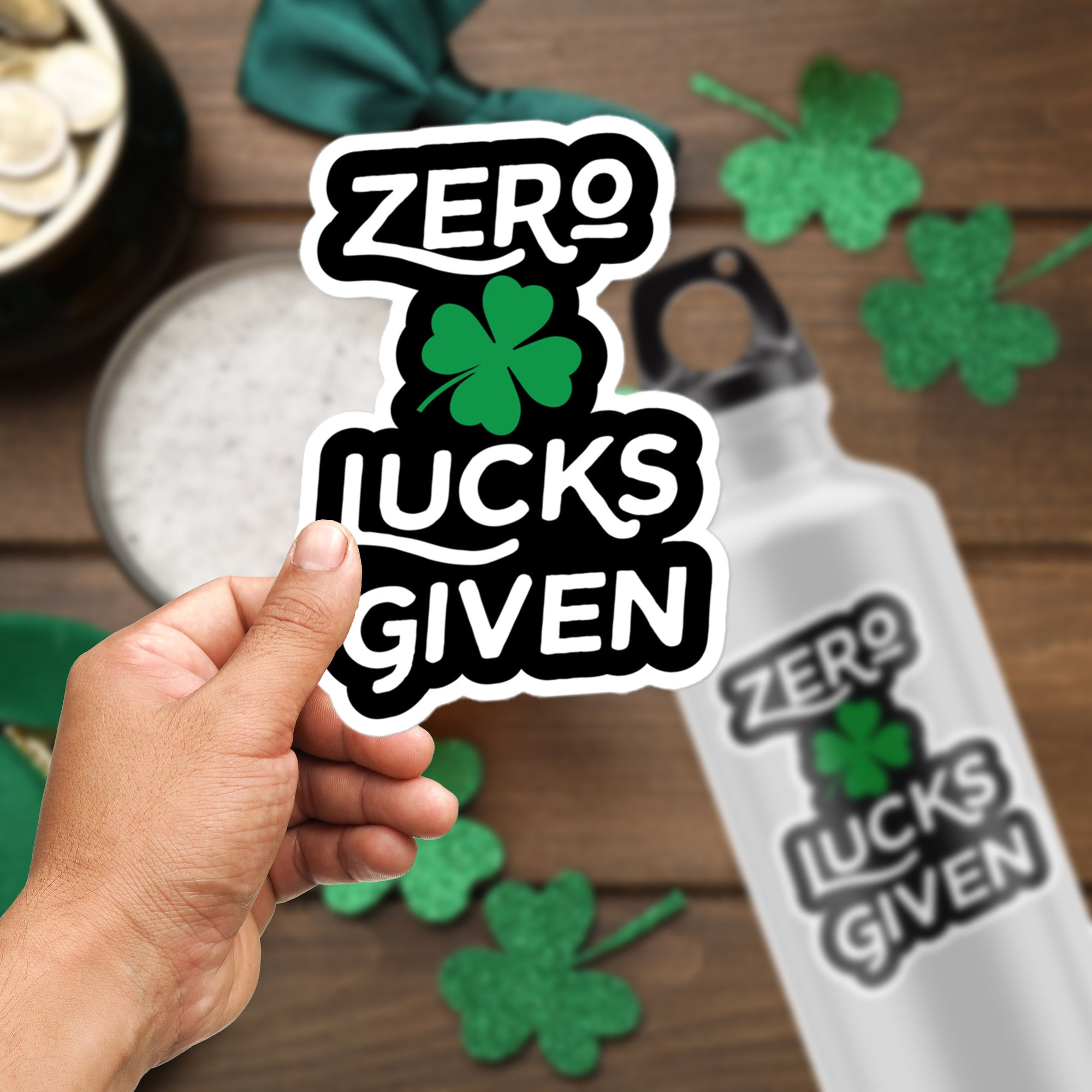 a person holding a sticker that says zero luck's given