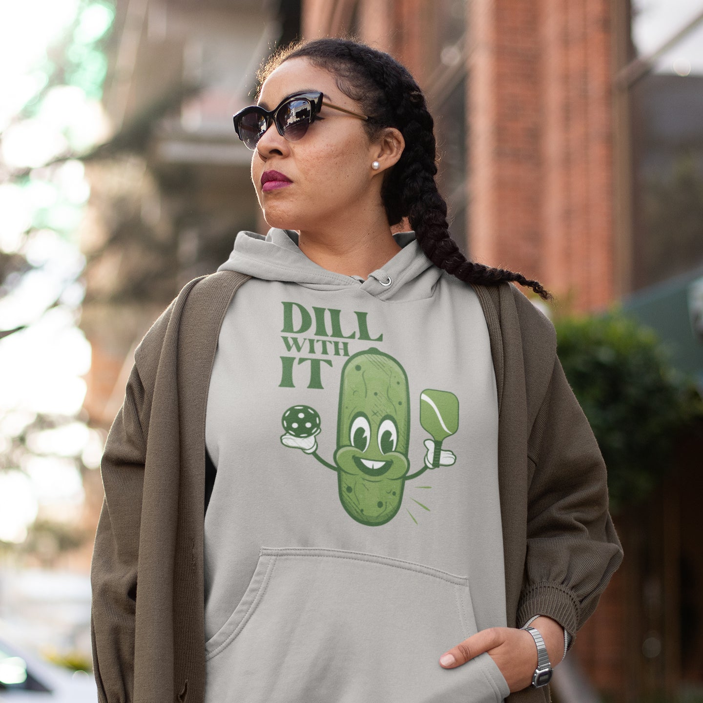 a woman wearing a sweatshirt that says dill with it