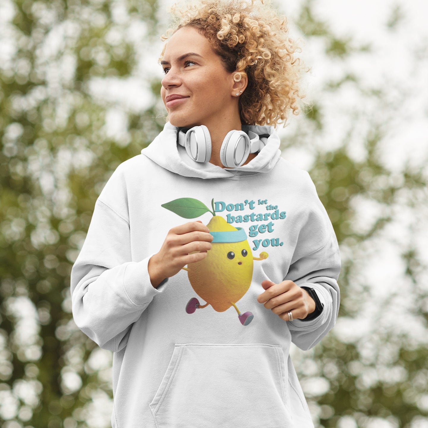 a woman wearing a white hoodie with a lemon on it