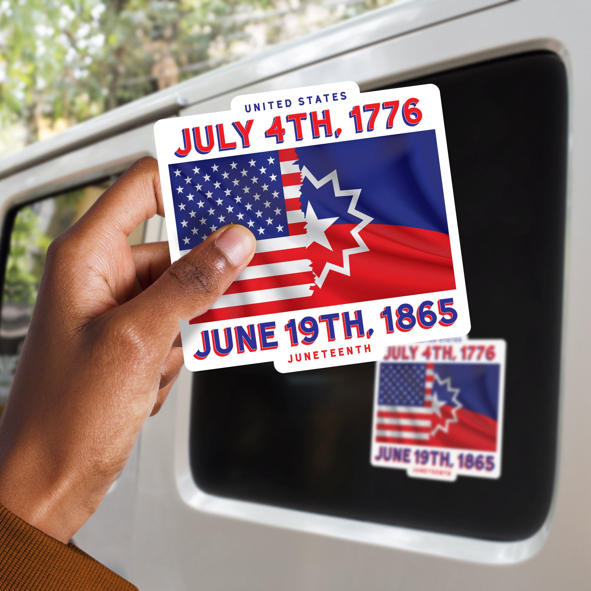 a person holding up a sticker with a flag on it