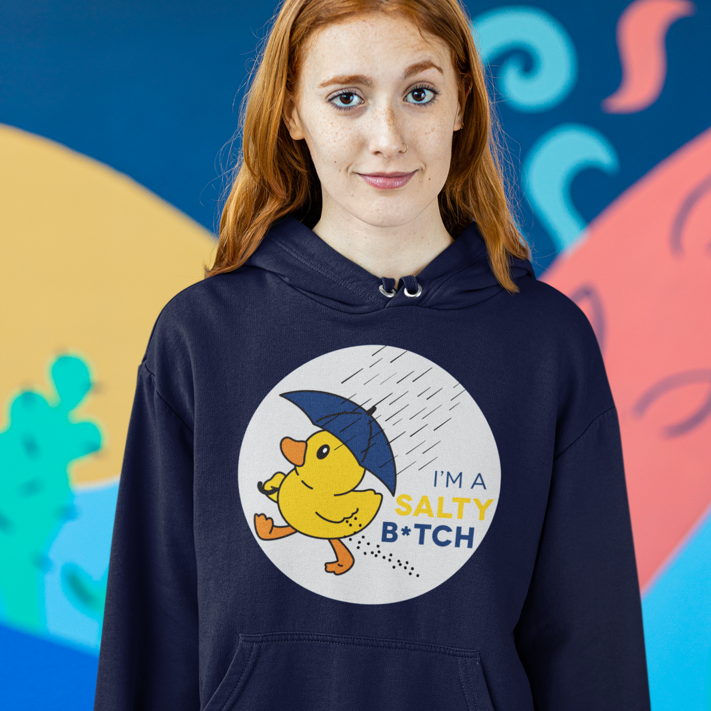 a girl wearing a hoodie with a yellow duck on it