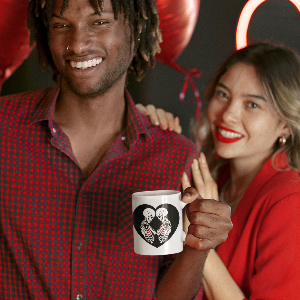 a man and a woman holding a coffee mug