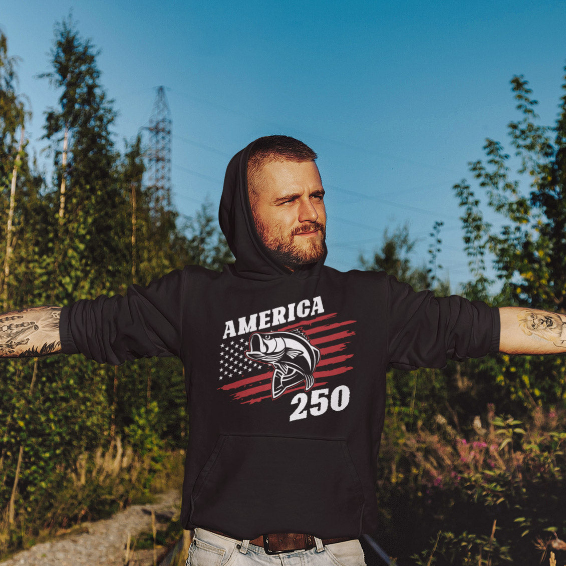 a man wearing a hoodie with his arms outstretched