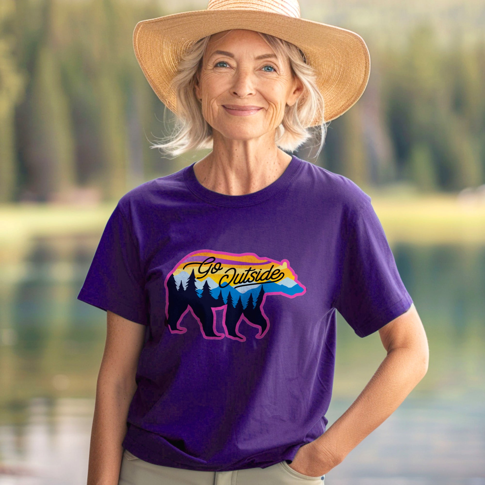 a woman wearing a purple shirt with a bear on it