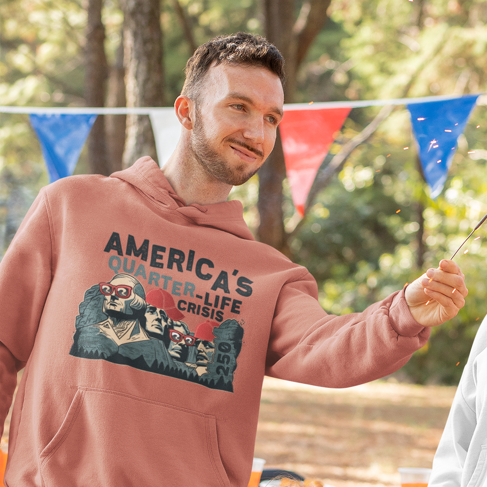 a man in a hoodie is holding a stick