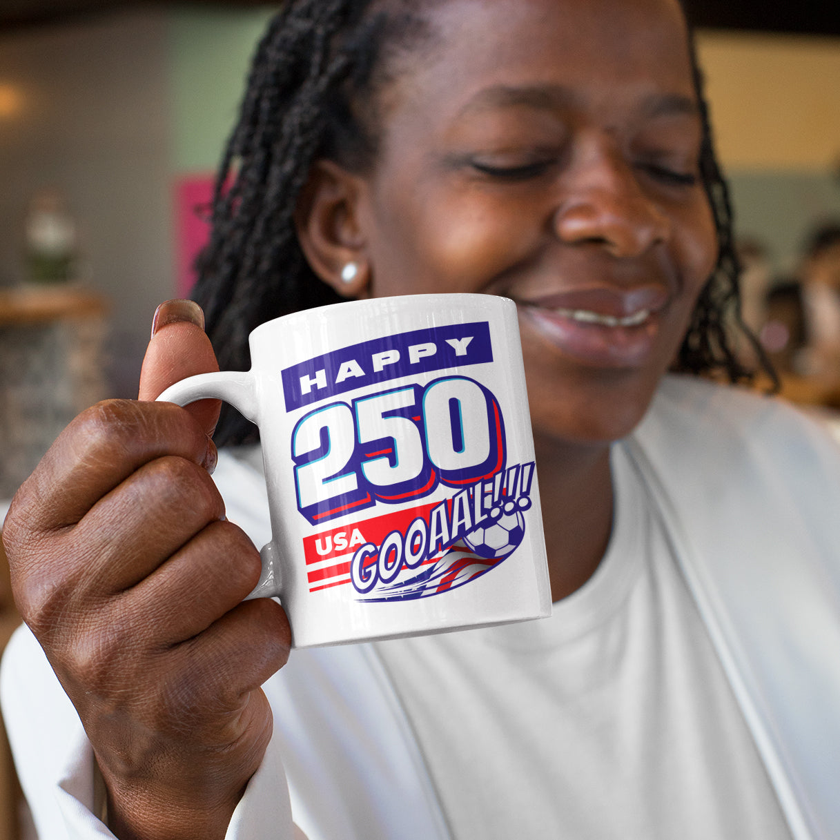 a woman holding a coffee mug in her right hand