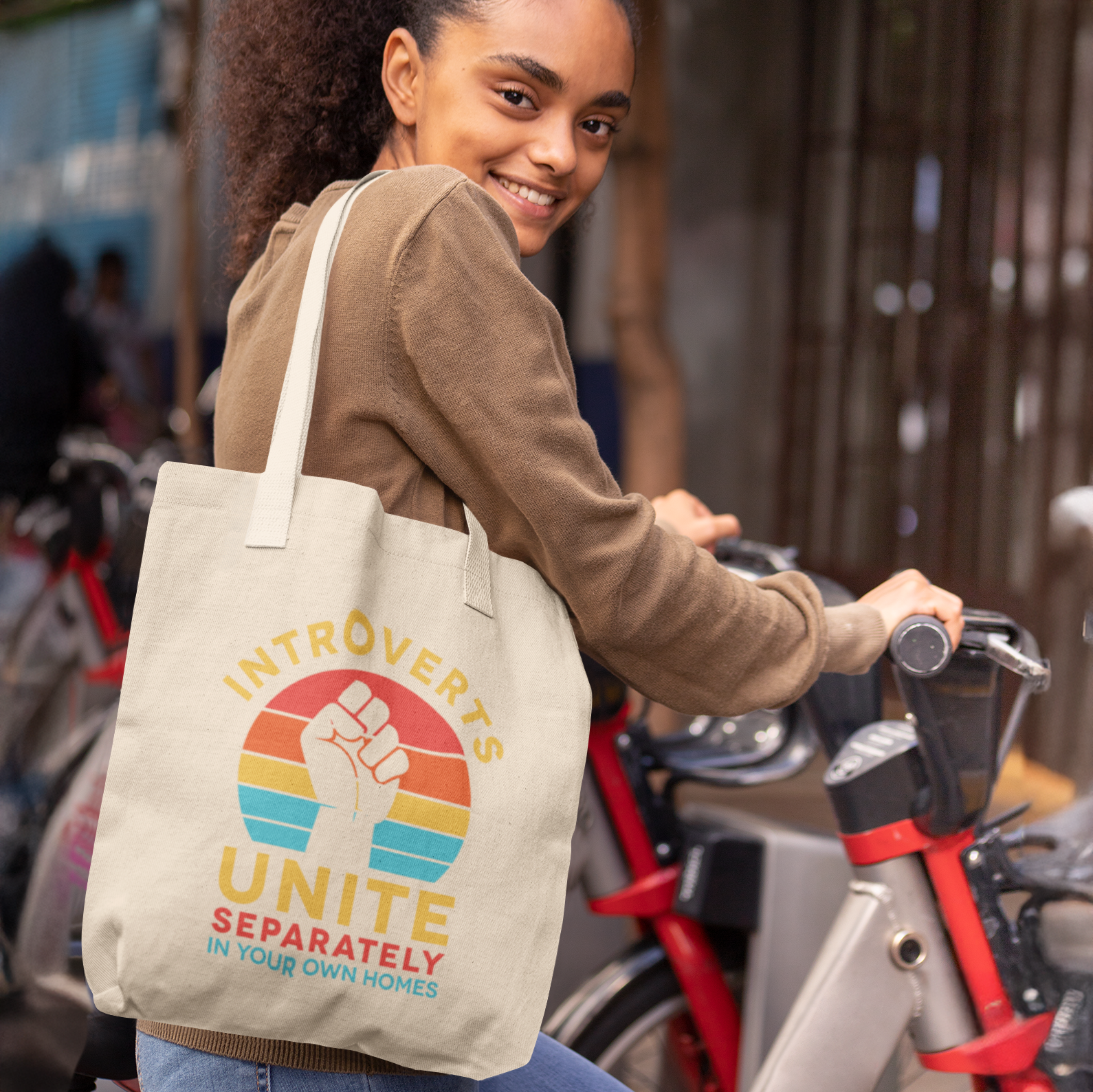 a woman is smiling while holding a bag