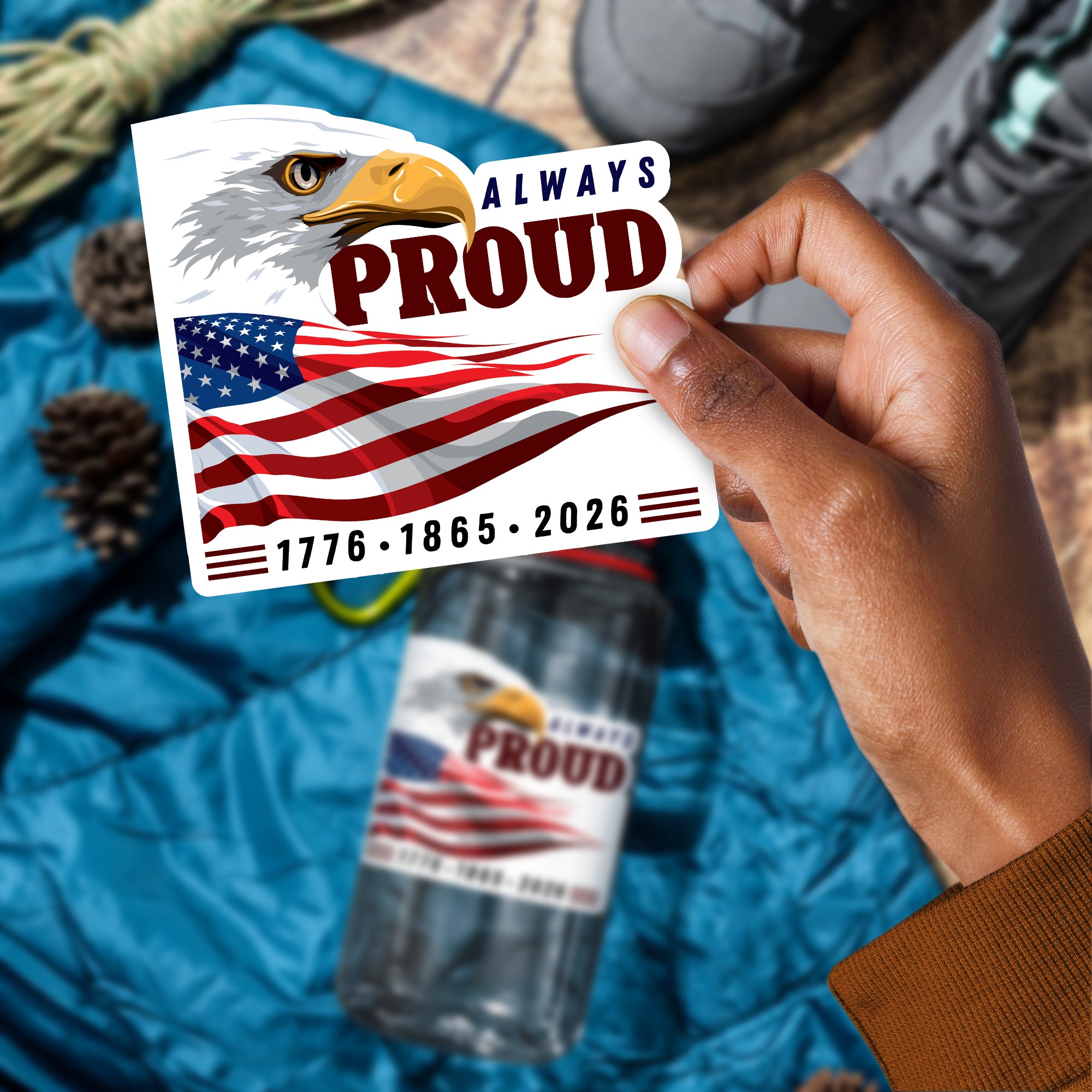 a person holding up a sticker with an eagle on it