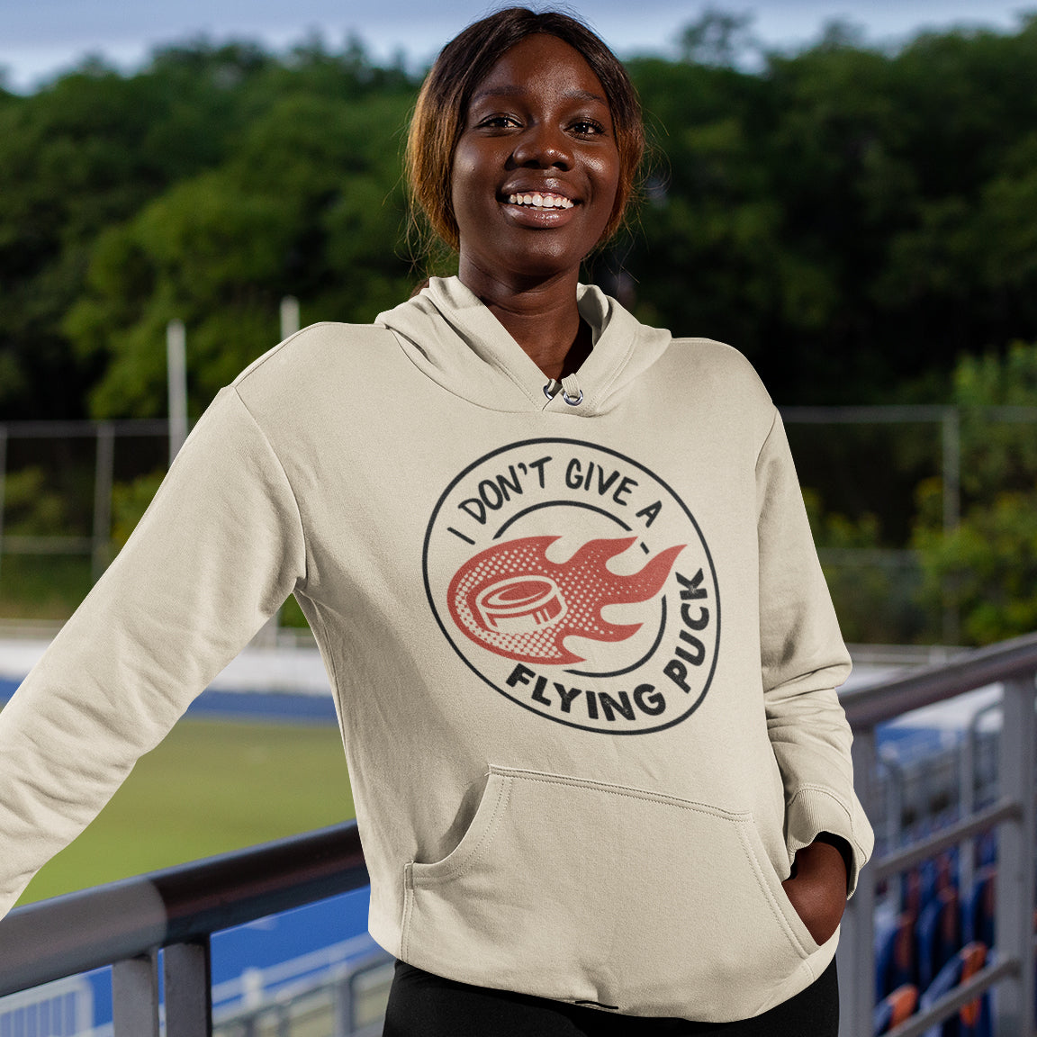 a woman wearing a hoodie that says don't give a flying fish