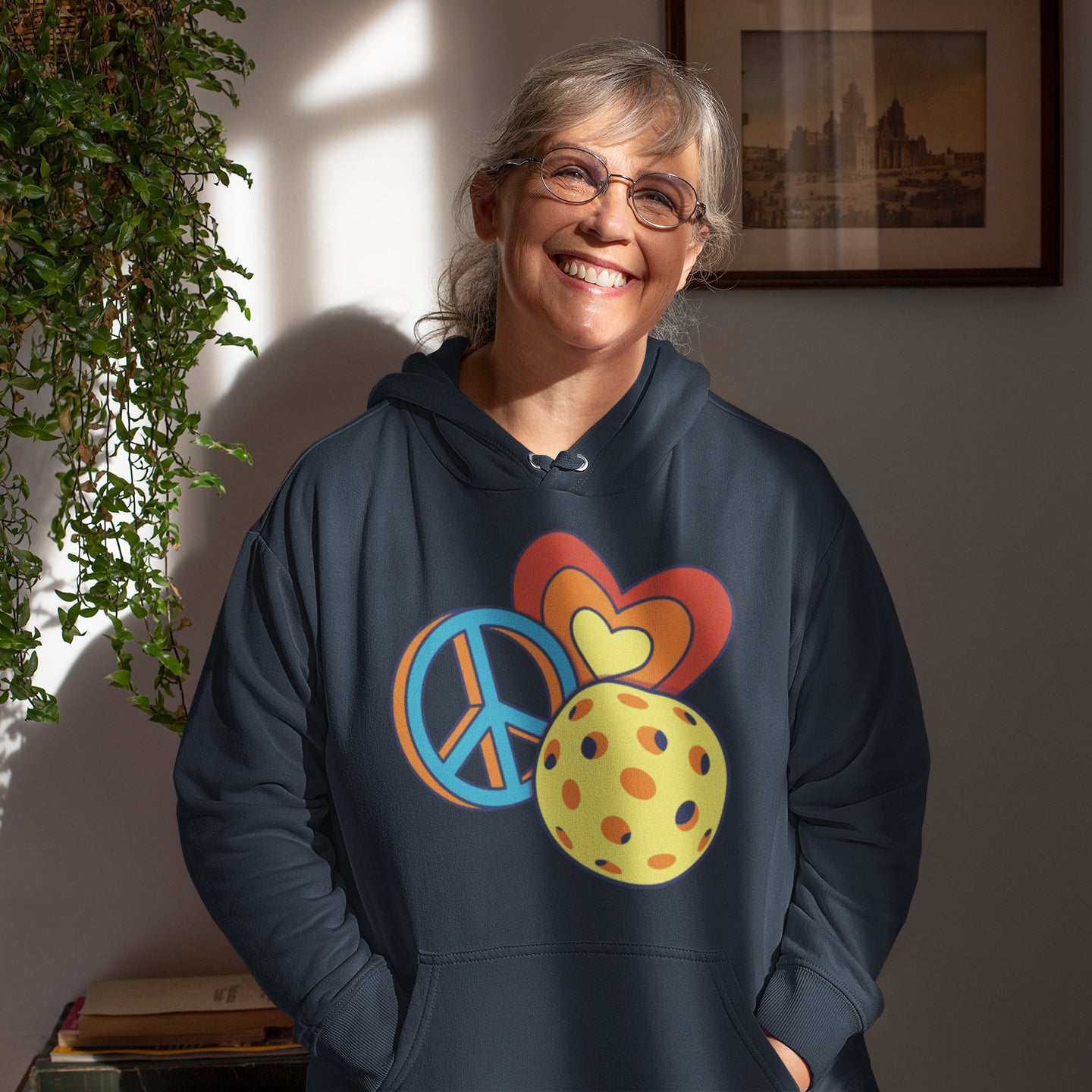 an older woman wearing a peace sign hoodie