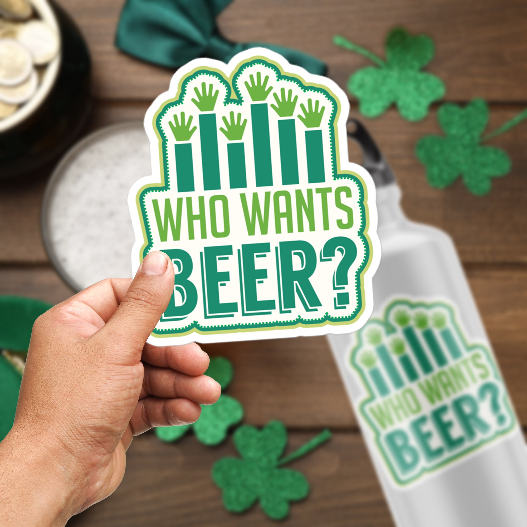 a person holding a sticker that says who wants beer?