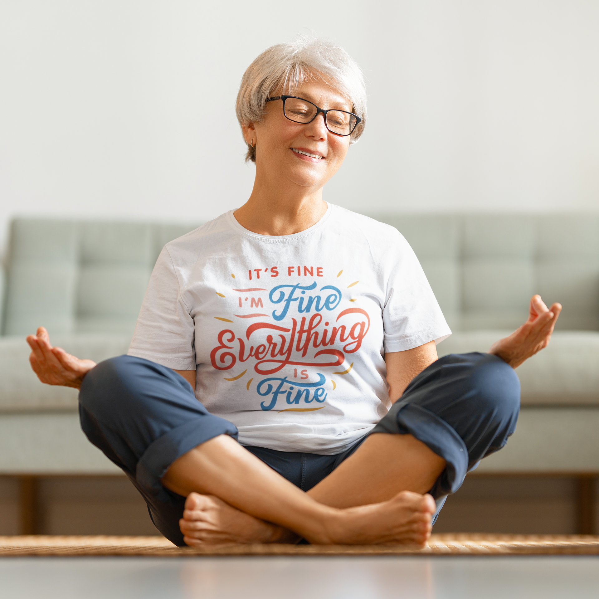 a woman sitting on the floor in a yoga pose