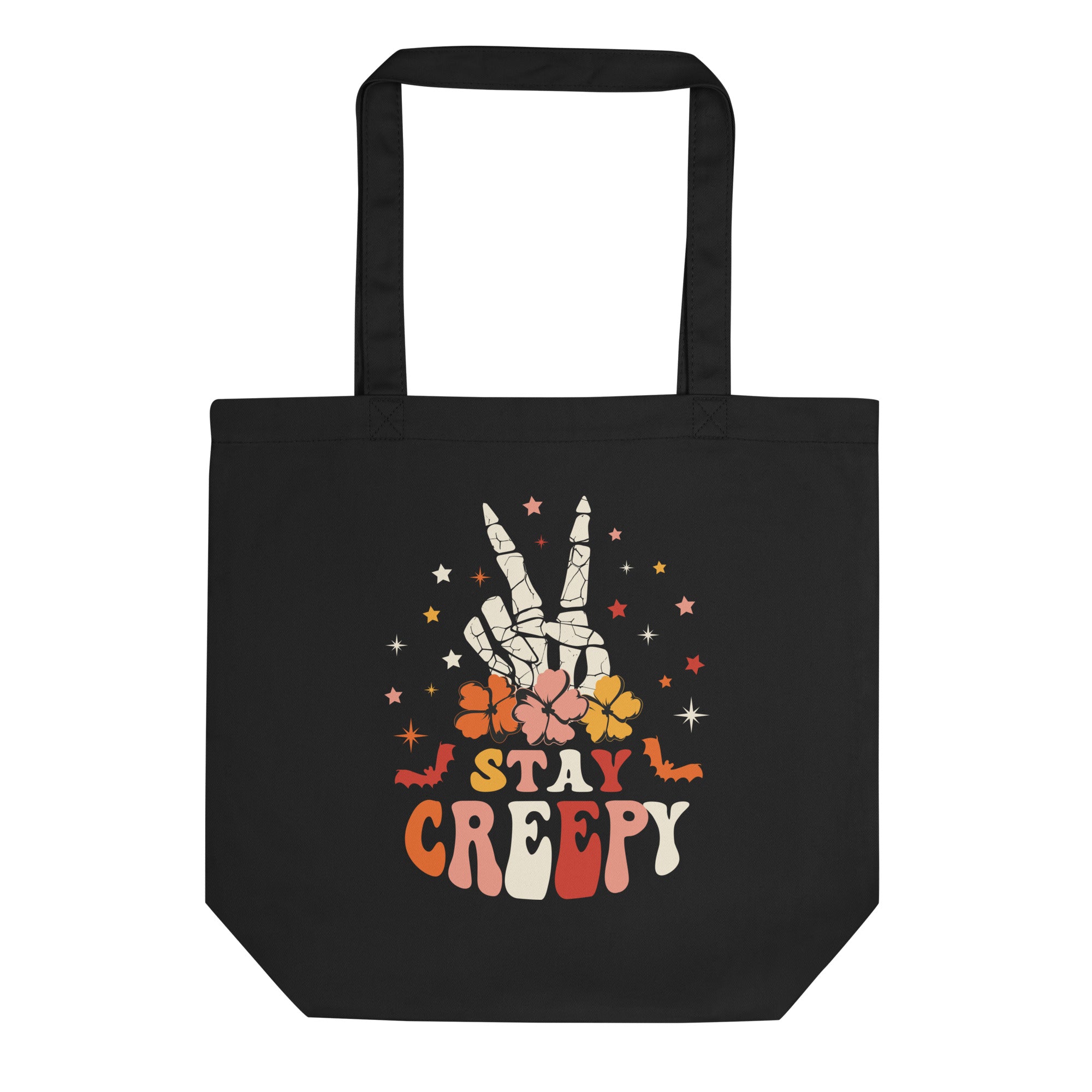 a black tote bag that says stay creepy