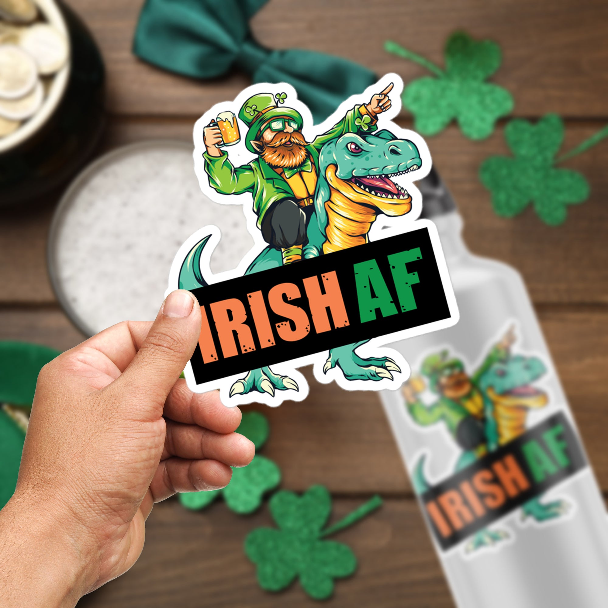 a hand holding a sticker that says irish af