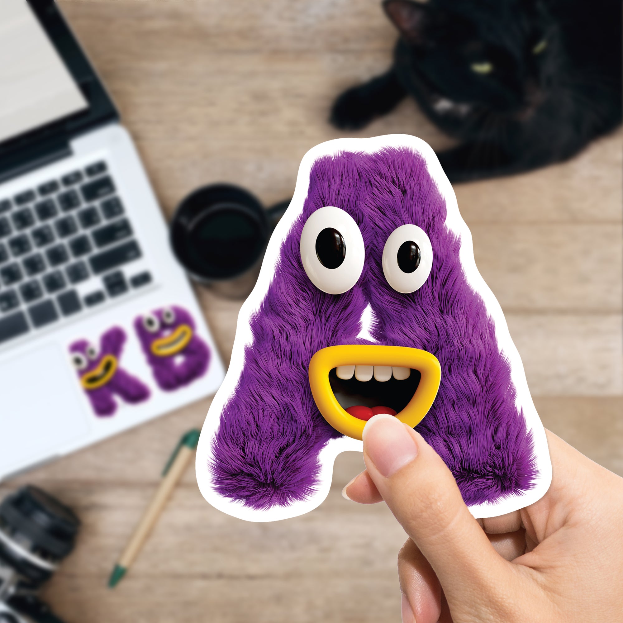 a hand holding a purple sticker with eyes and mouth