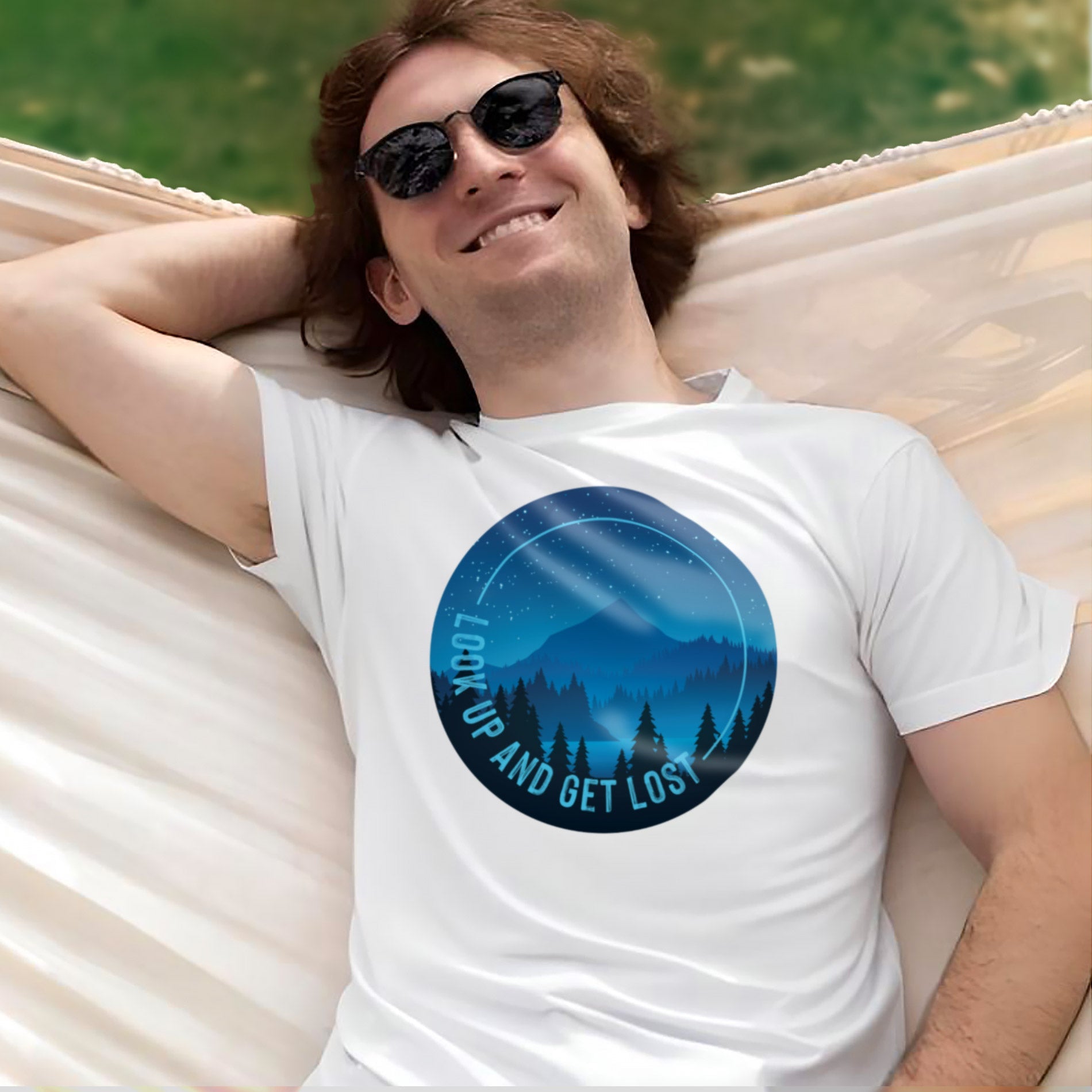 a man laying in a hammock wearing a t - shirt that says land