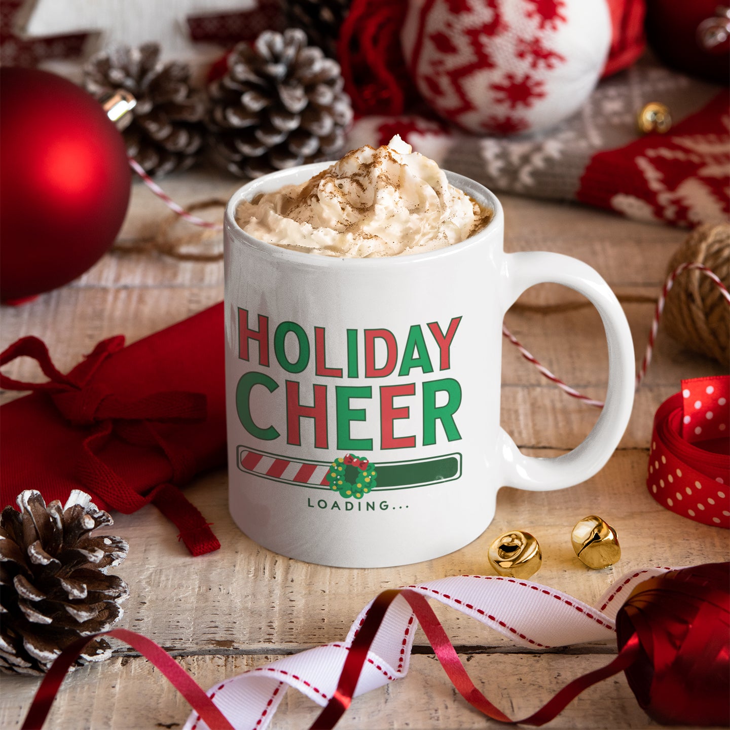 a holiday cheer mug with whipped cream in it