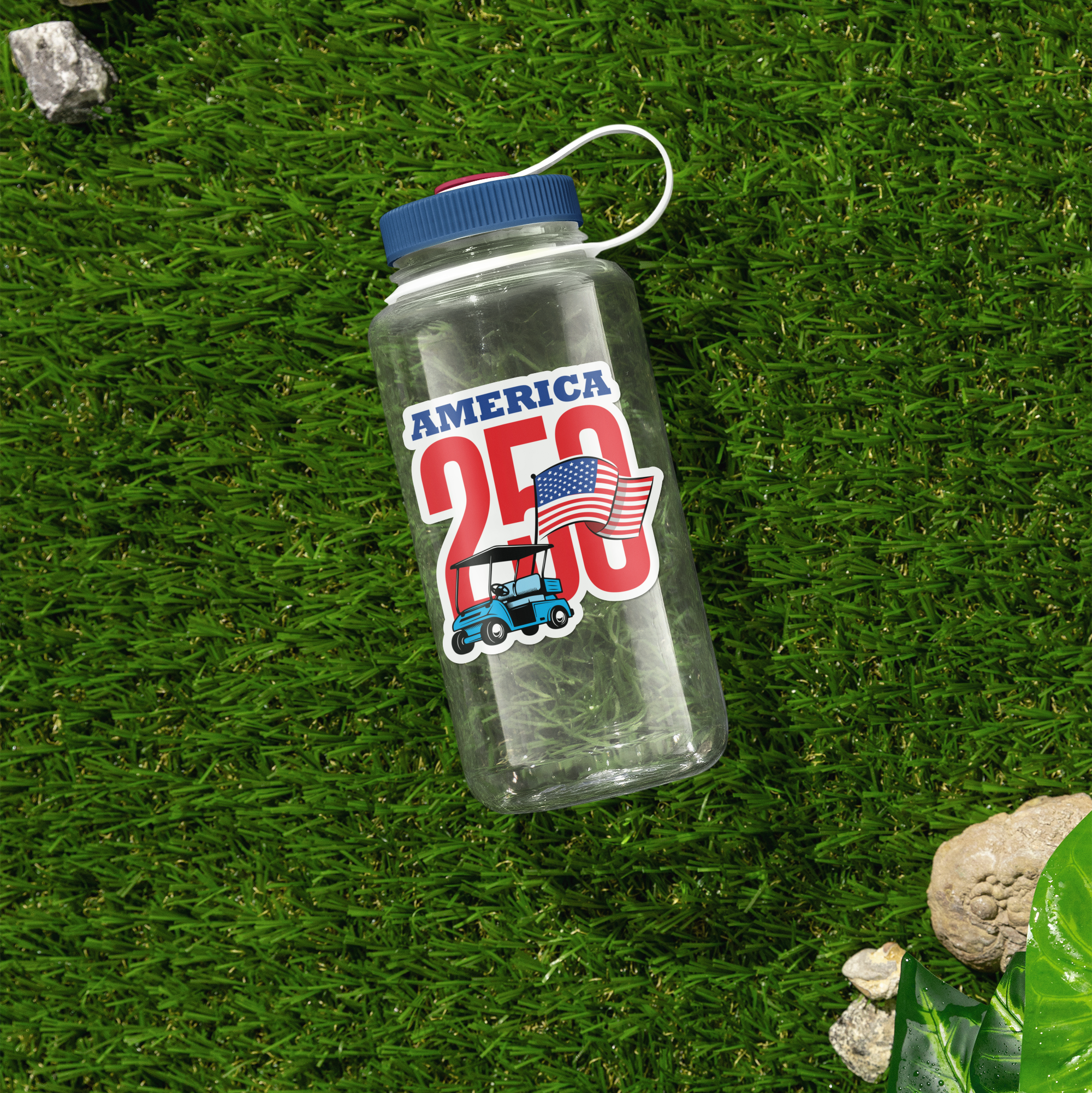 a water bottle sitting on top of a lush green field