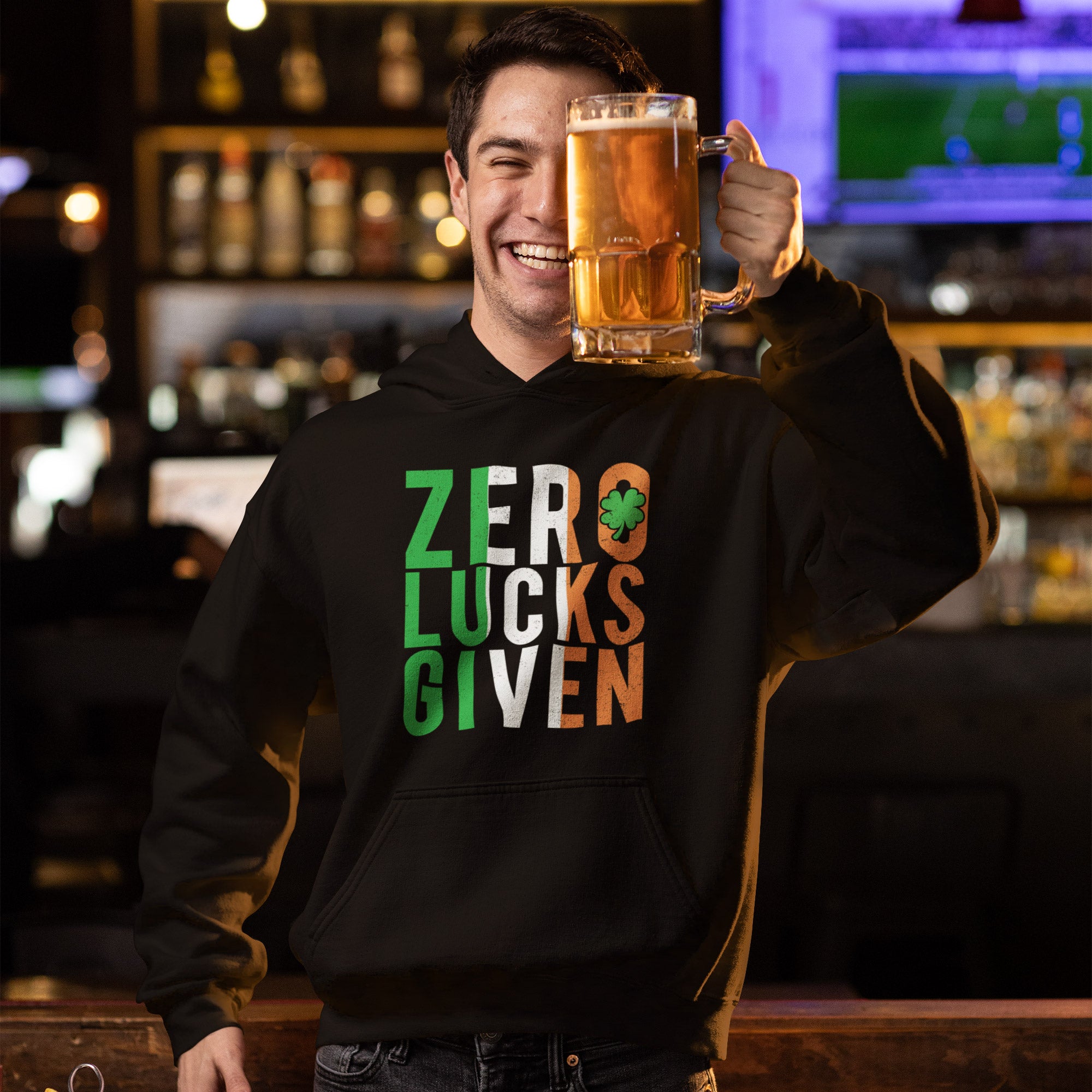 a man holding a mug of beer in front of his face