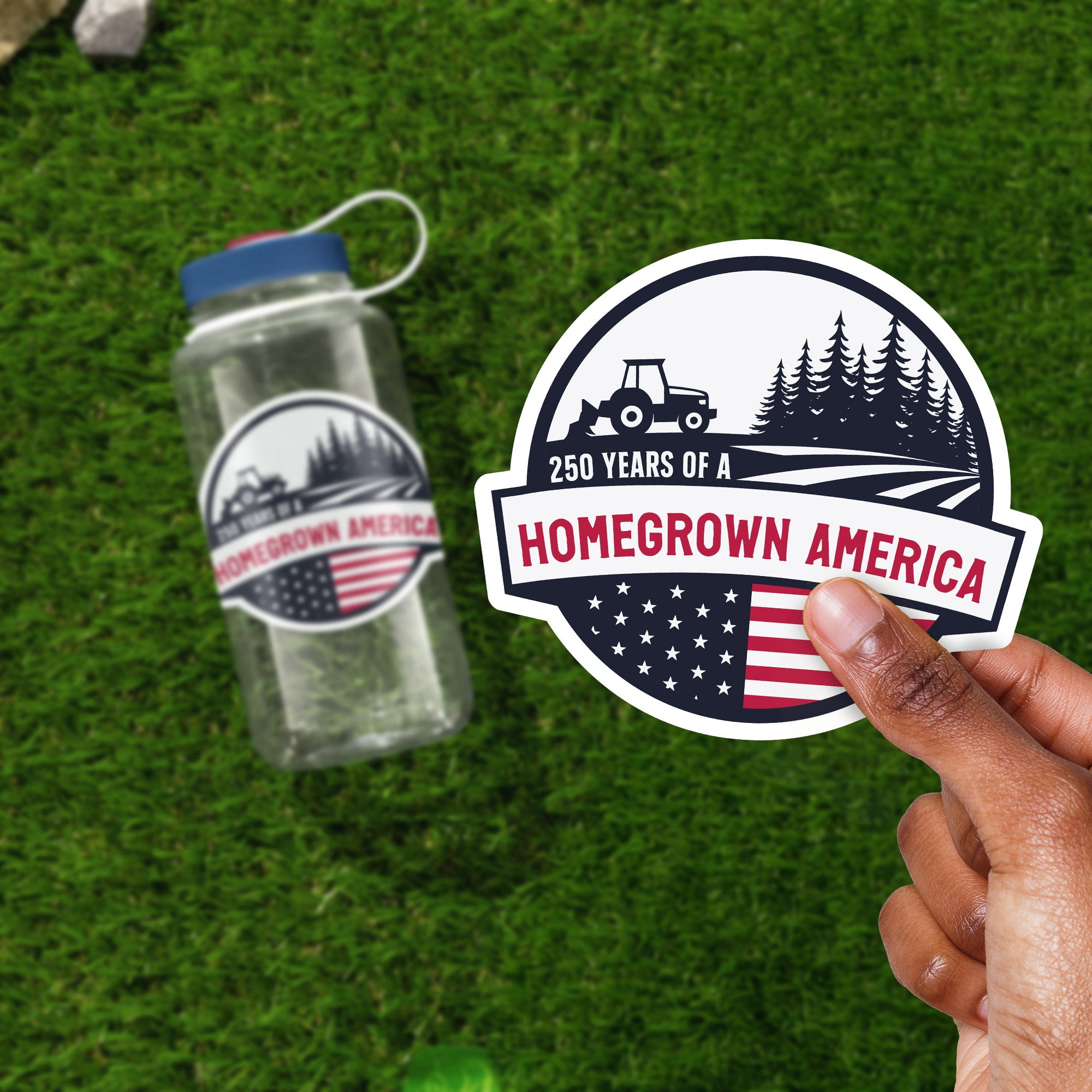 a person holding a sticker next to a water bottle