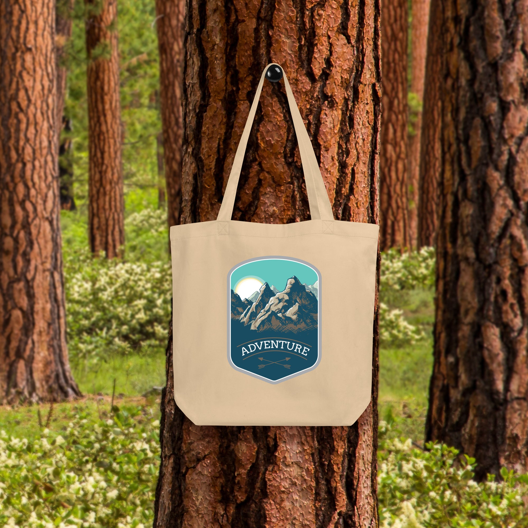 a tote bag hanging on a tree in a forest