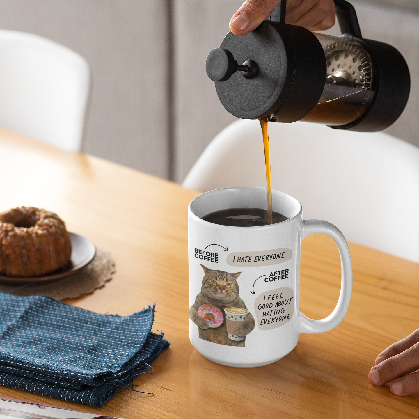 a person pouring coffee into a coffee mug