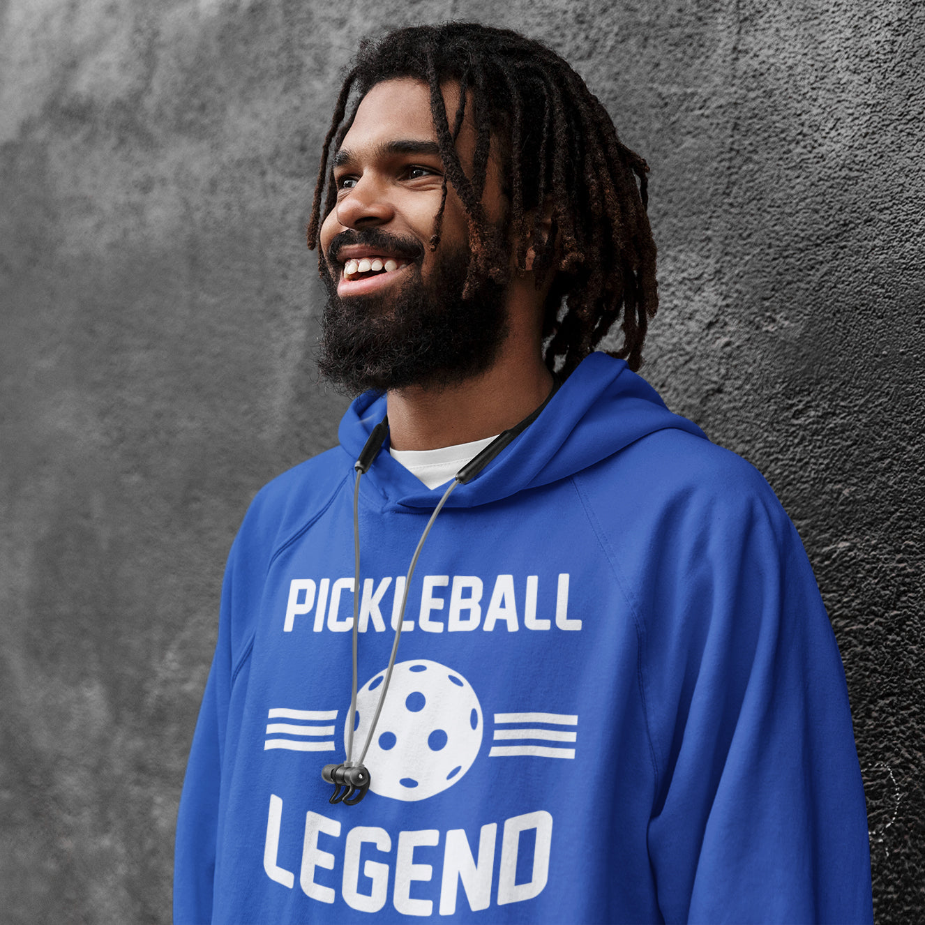 a man with dreadlocks wearing a blue hoodie