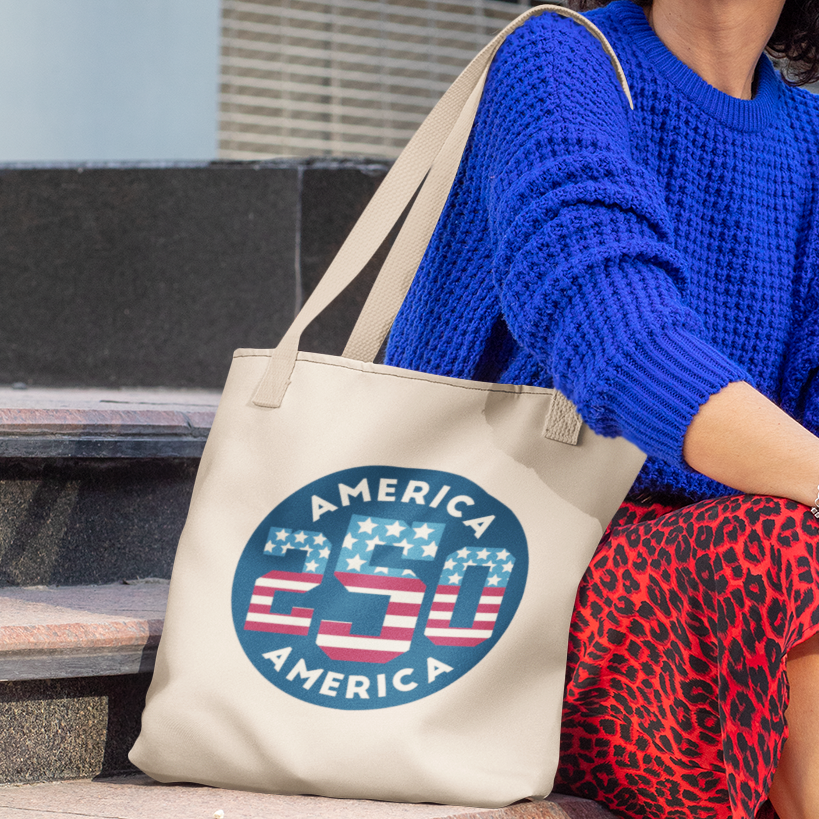 a woman sitting on a bench holding a bag