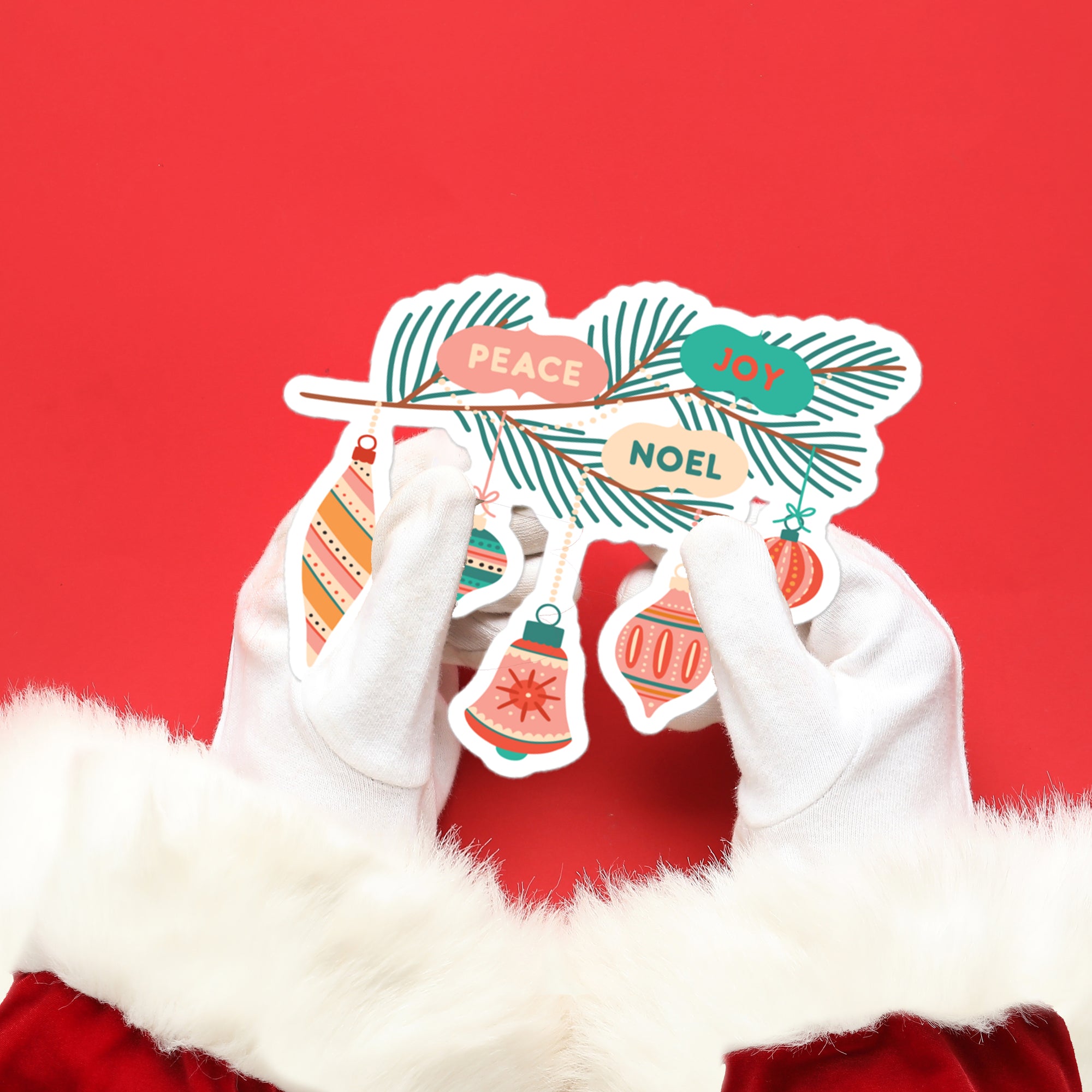 a pair of white gloves with christmas decorations on them