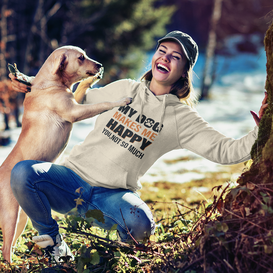 a woman kneeling down next to a dog