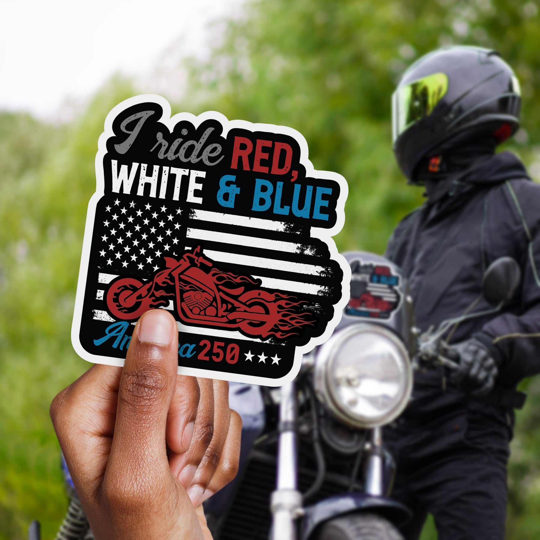 a sticker of a motorcyclist holding up a red white and blue