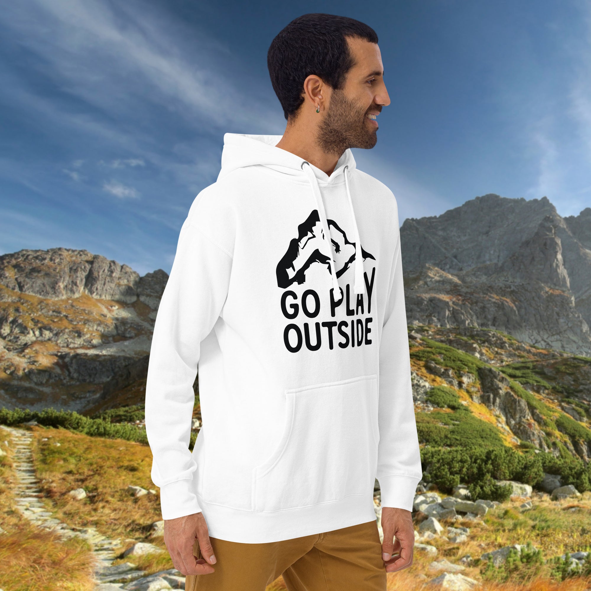 a man wearing a white sweatshirt with the words go play outside printed on it