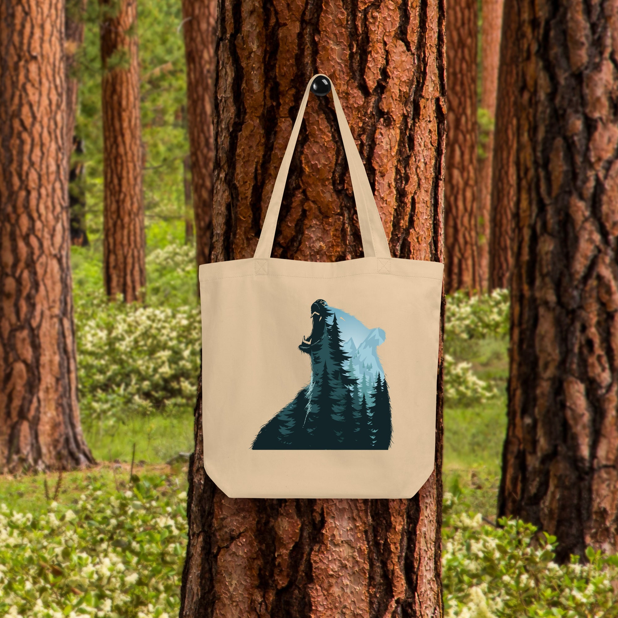 a tote bag hanging on a tree in a forest