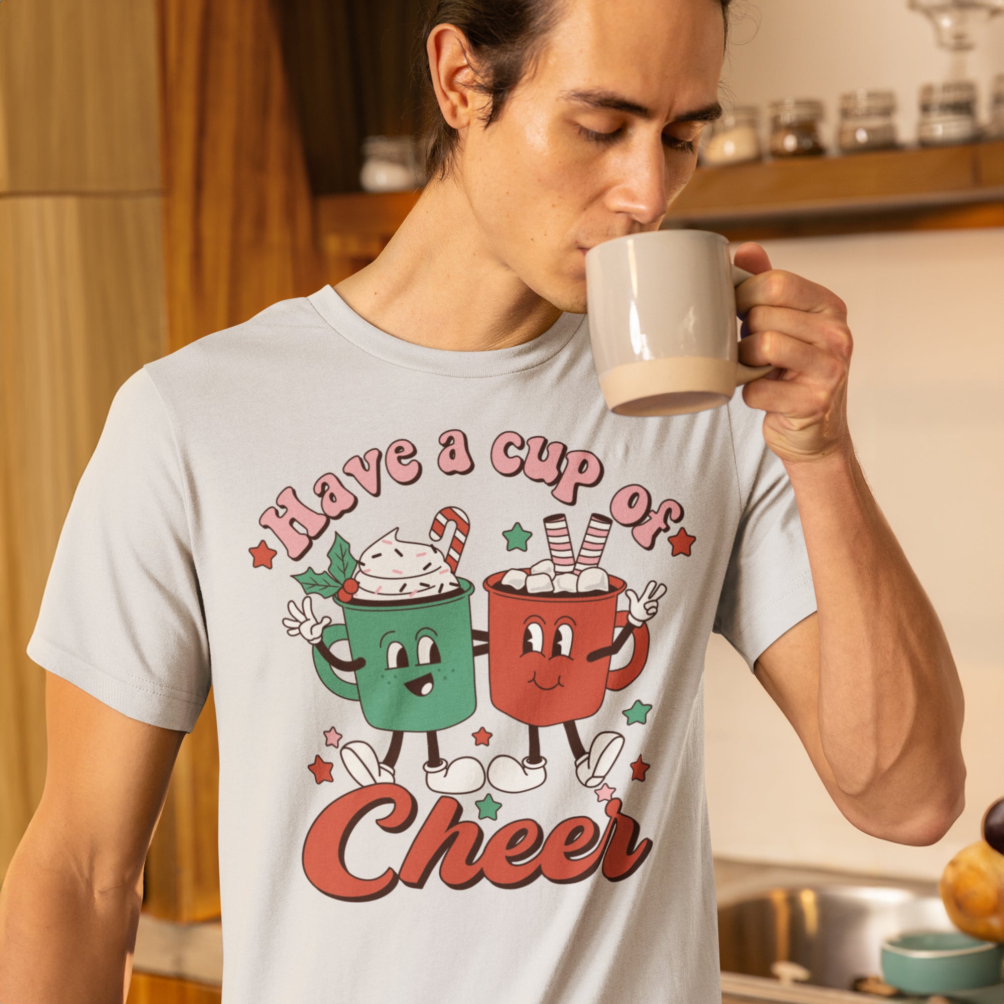 a man drinking a cup of coffee in a kitchen