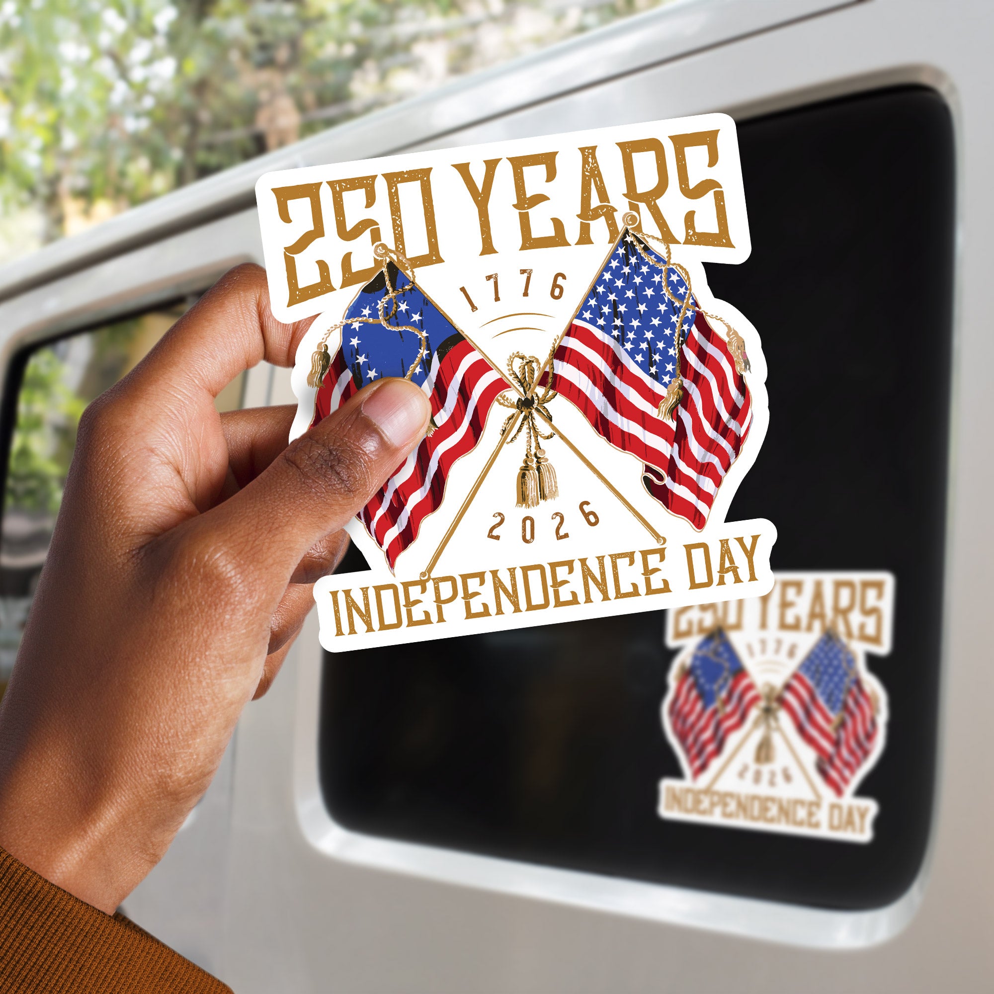 a person holding a sticker with two american flags on it