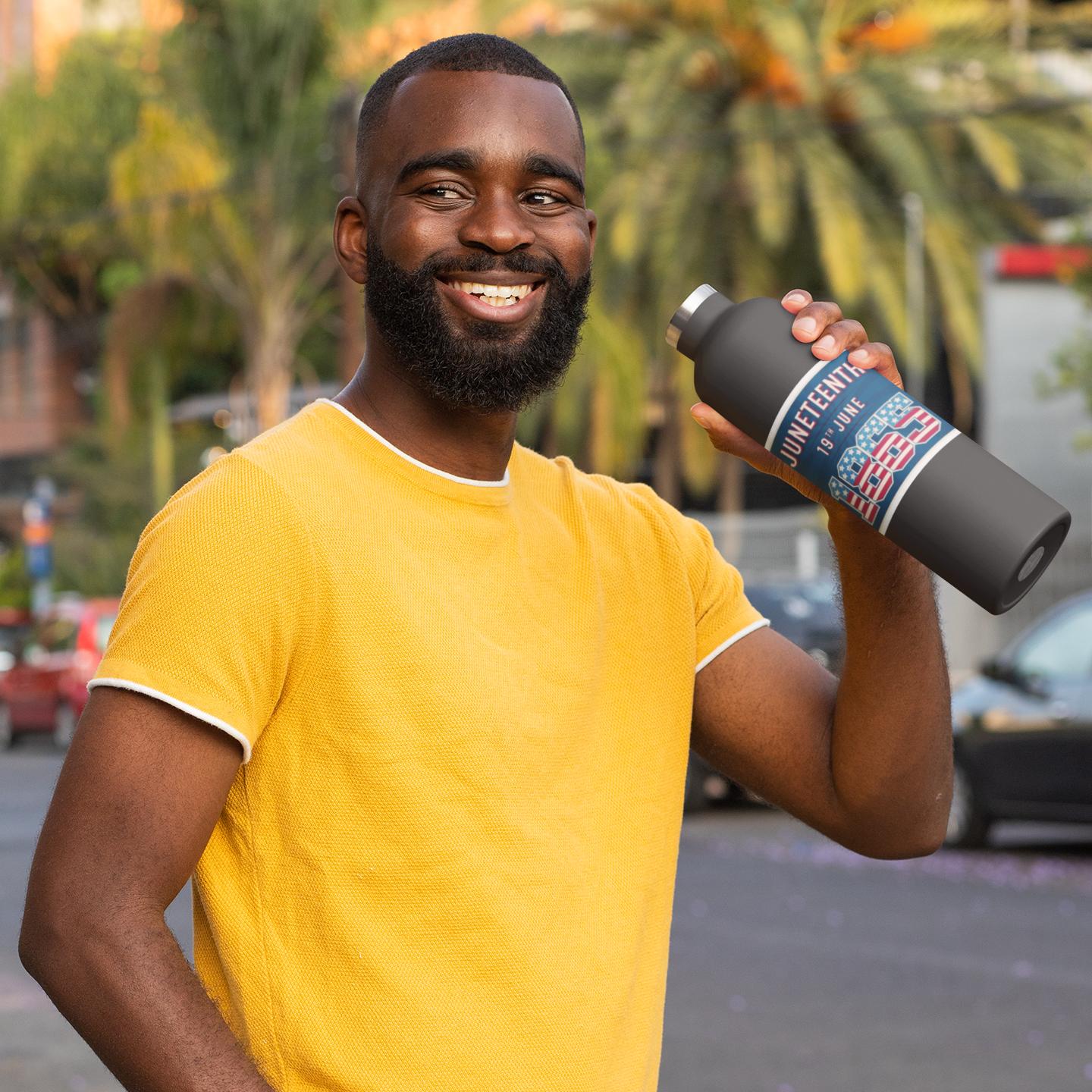 a man in a yellow shirt is holding a water bottle