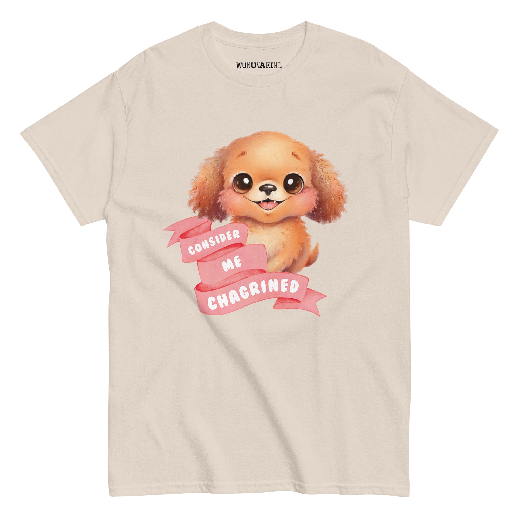 A t-shirt with a cartoon image of a dog and a pink banner with the text "CONSIDER ME CHAGRINED" printed on it.
