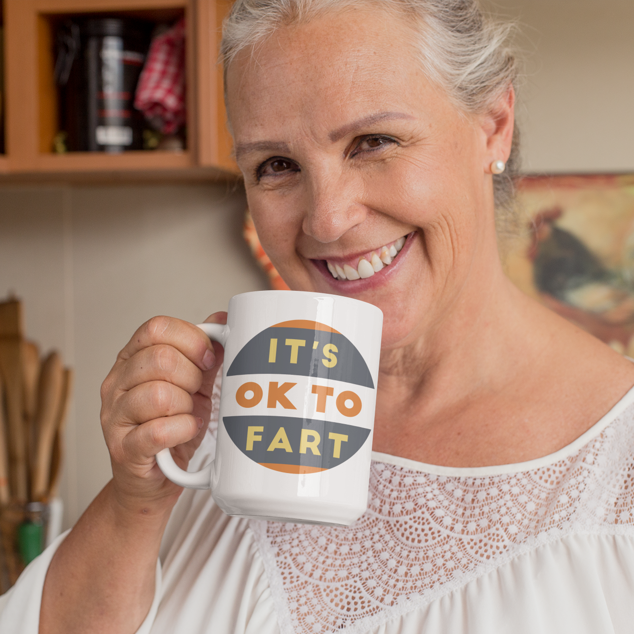 a woman is holding a coffee mug in her hands