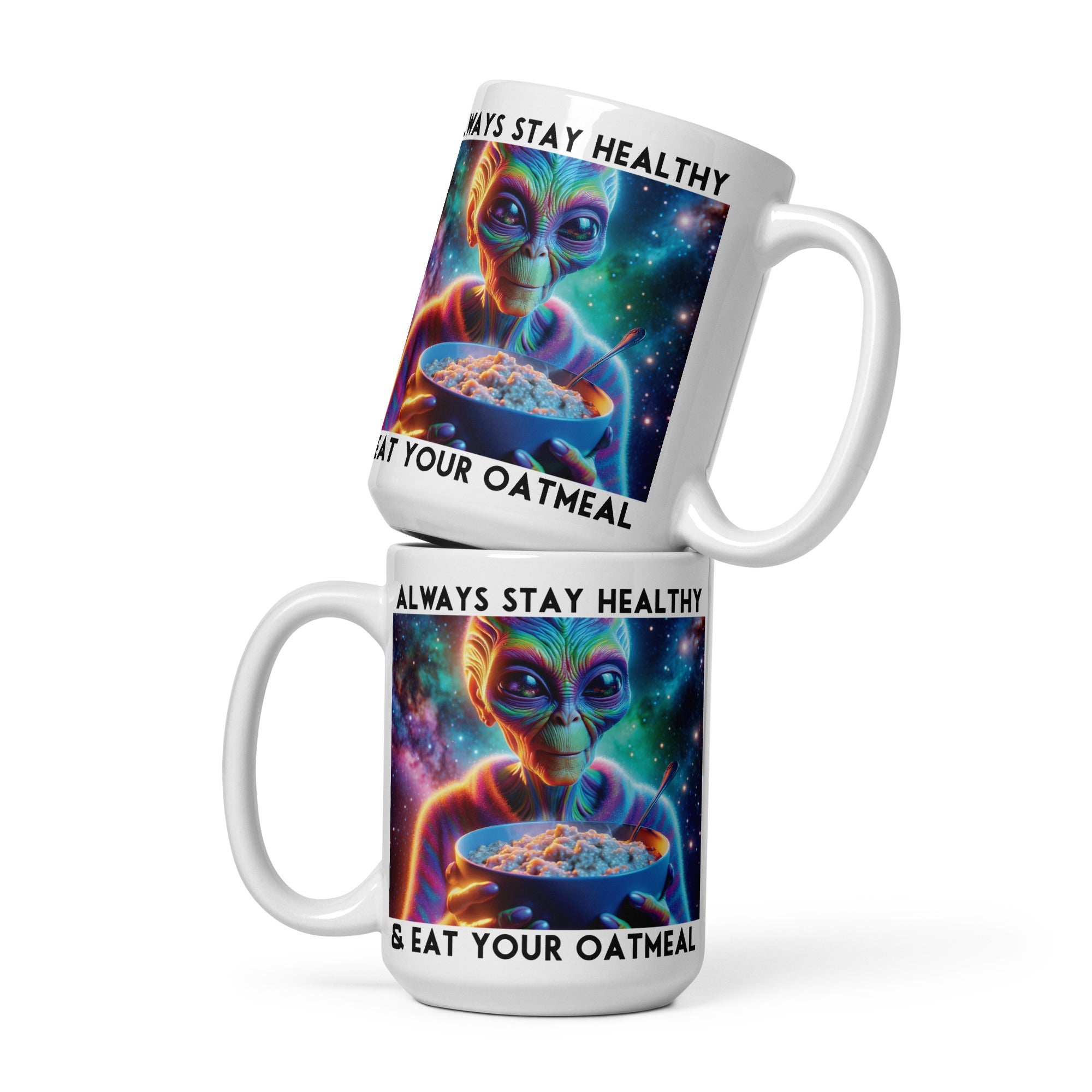 two coffee mugs with a picture of an alien holding a bowl of cereal