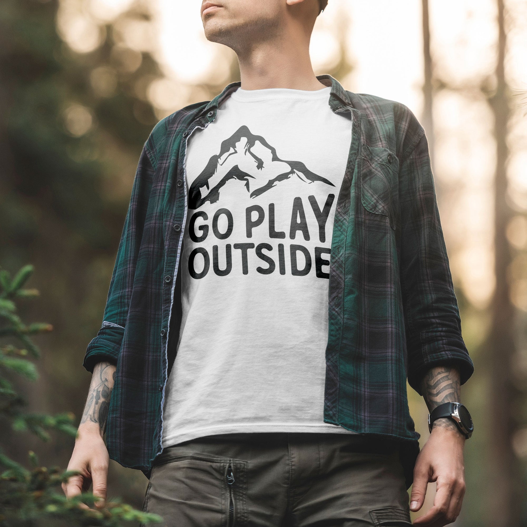 a man wearing a t - shirt that says go play outside