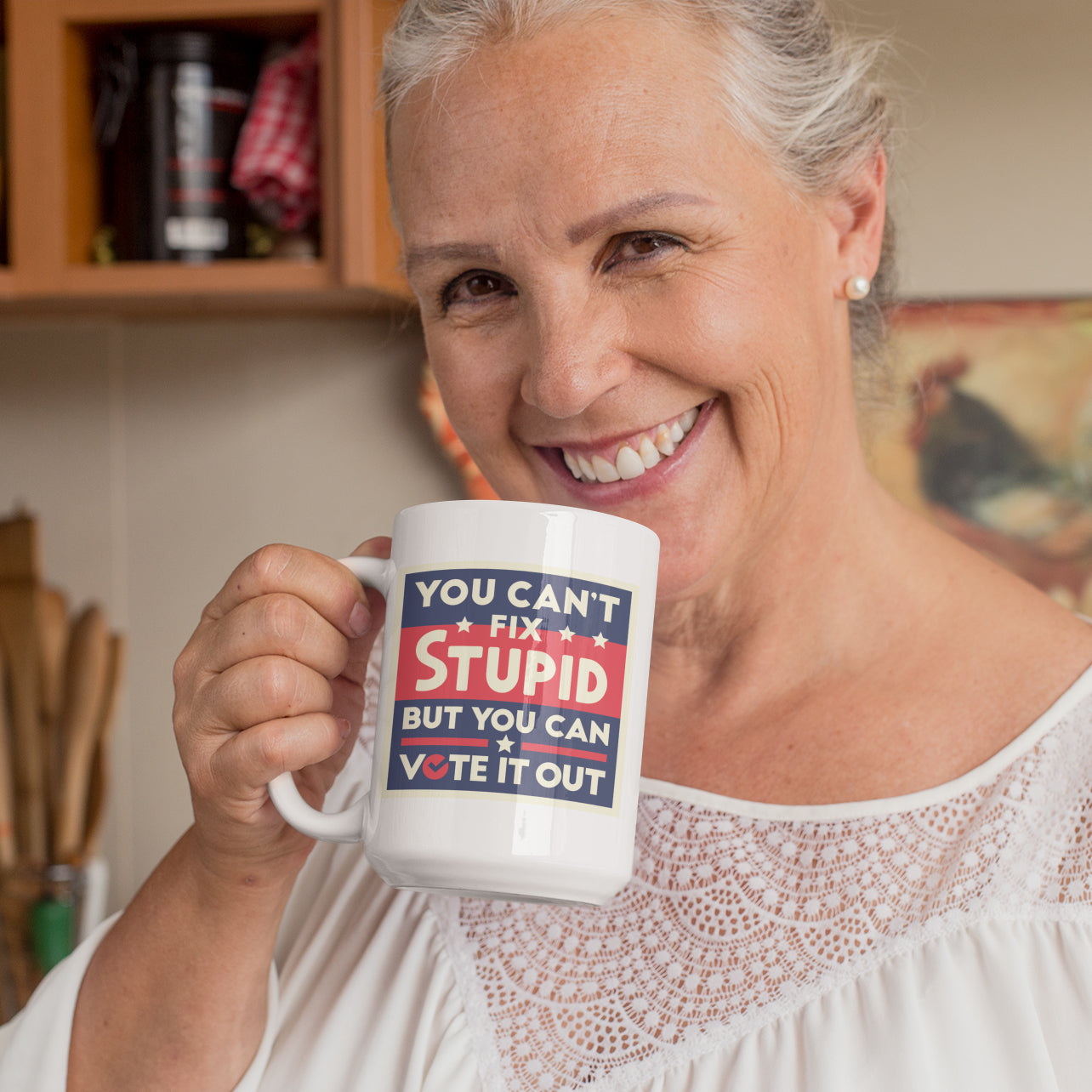 a woman is holding a coffee mug in her hands