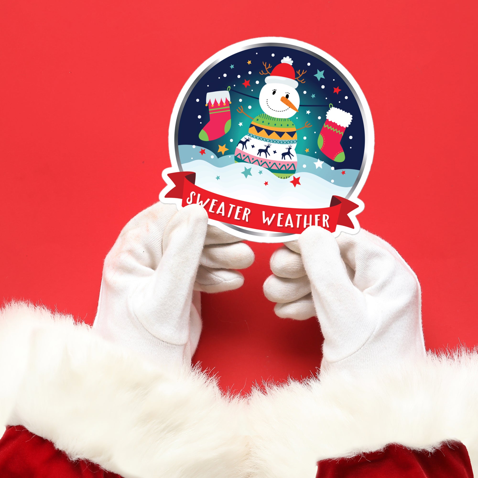 a person in a santa suit holding up a sticker