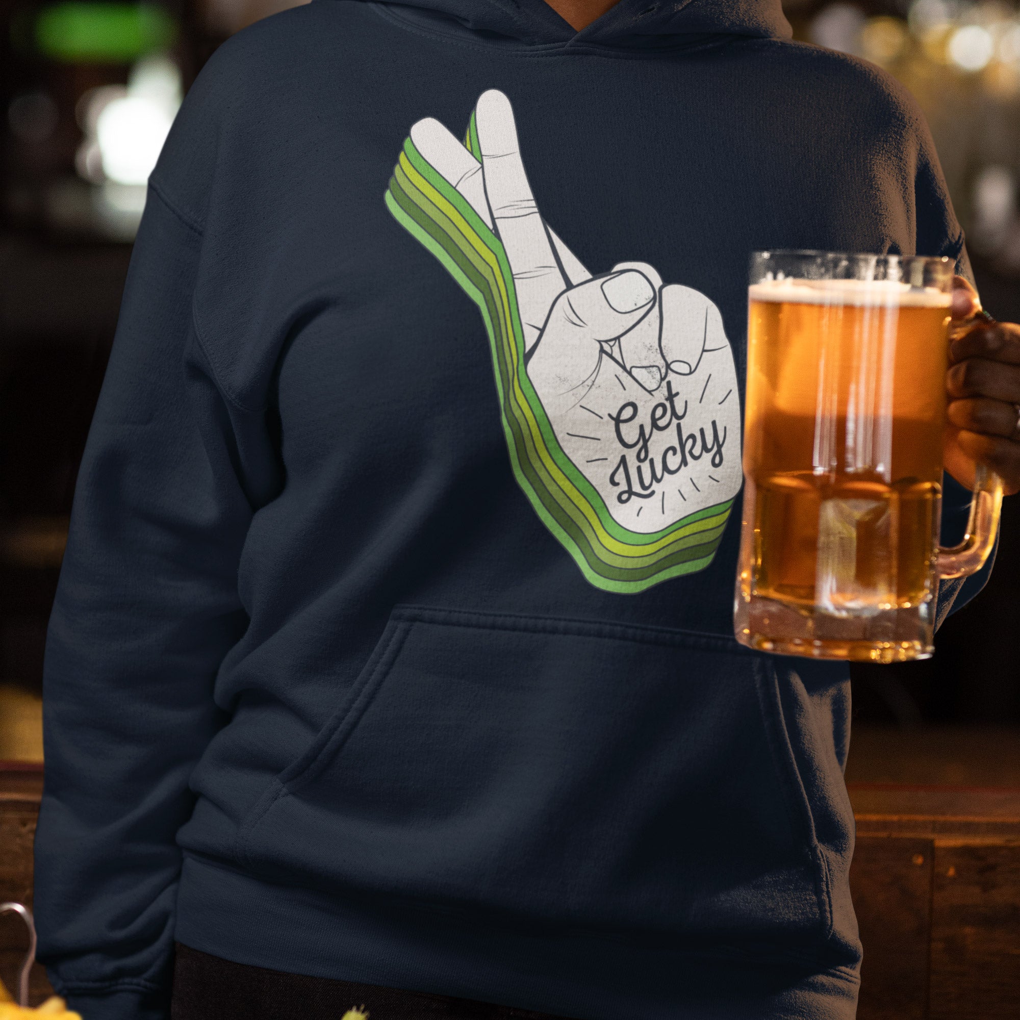 a man holding a mug of beer with a peace sign on it