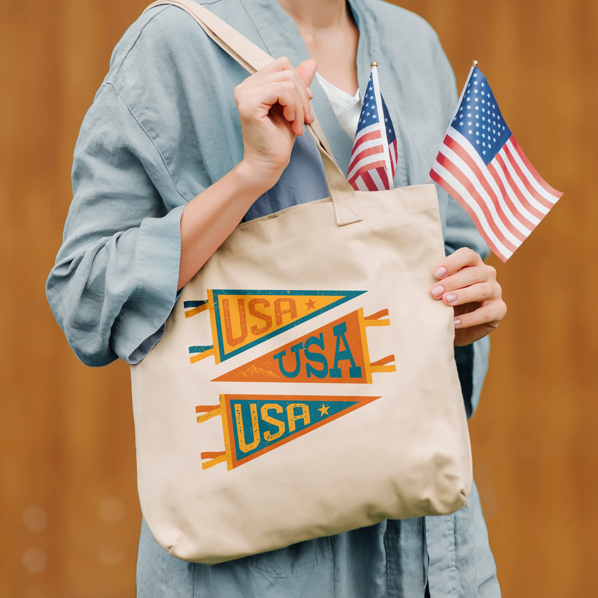 a woman holding a tote bag with an american flag