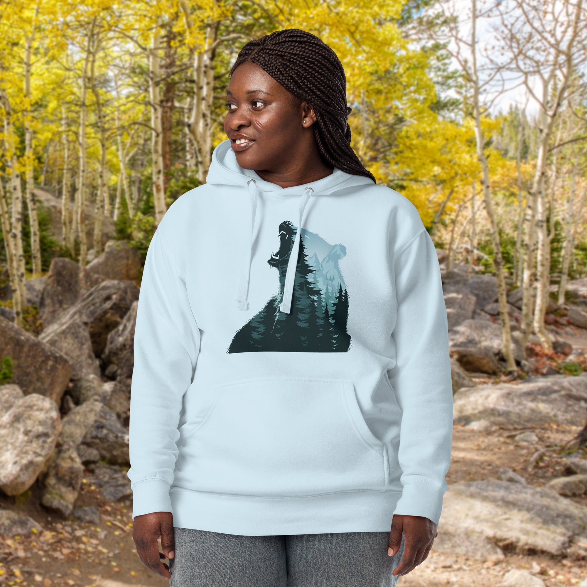 a woman wearing a white hoodie with a picture of a woman holding a knife