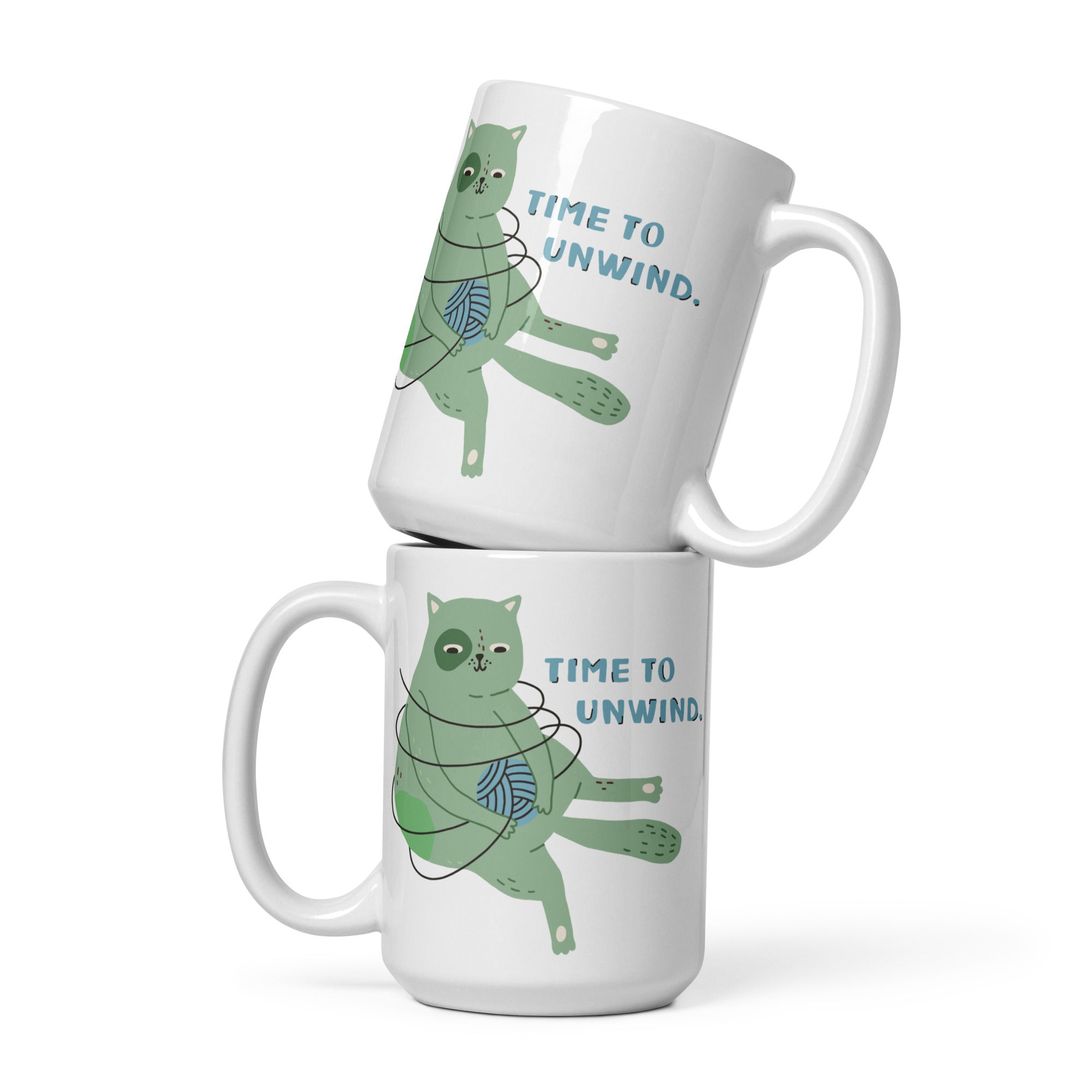 two white coffee mugs with green cats on them