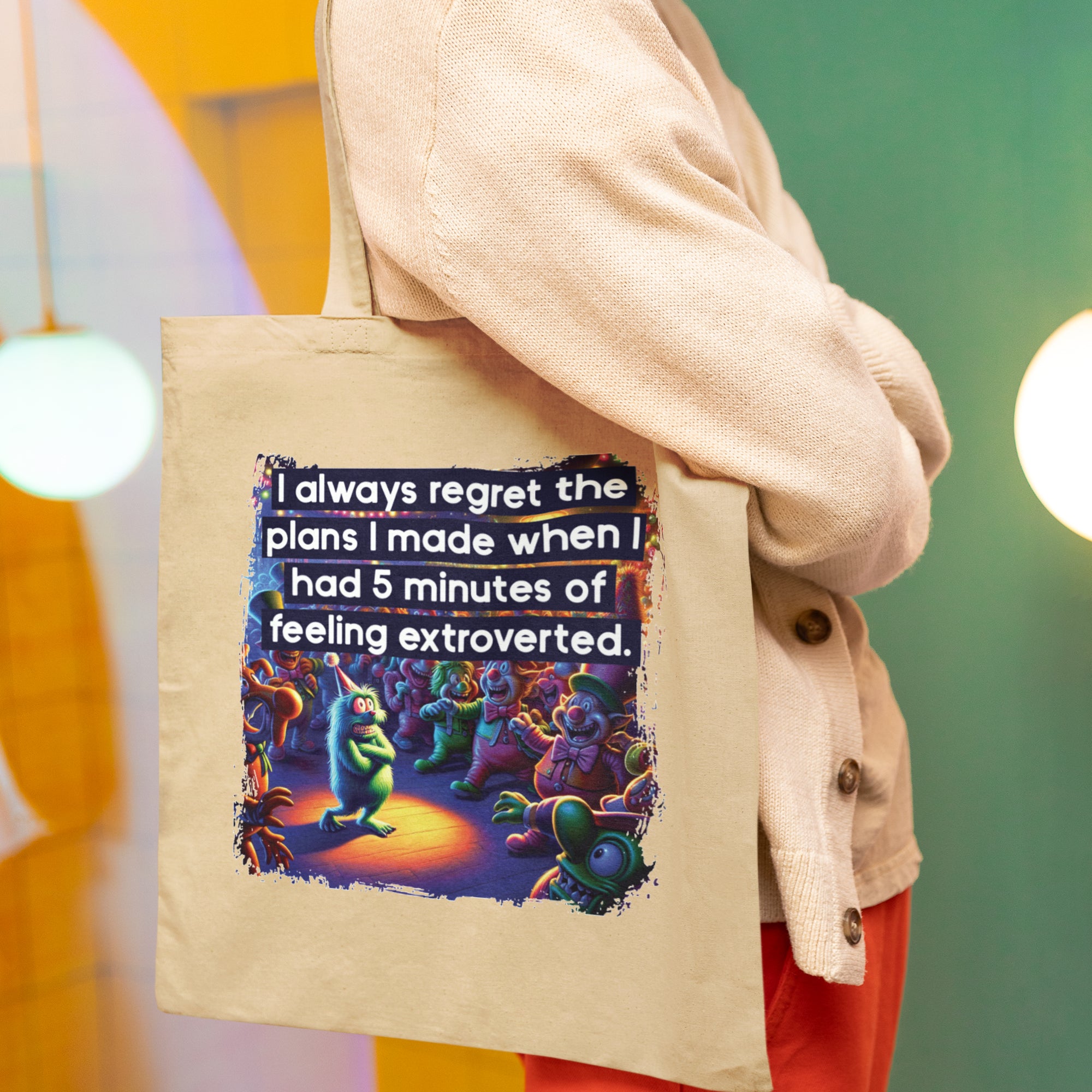 a woman holding a tote bag with a quote on it