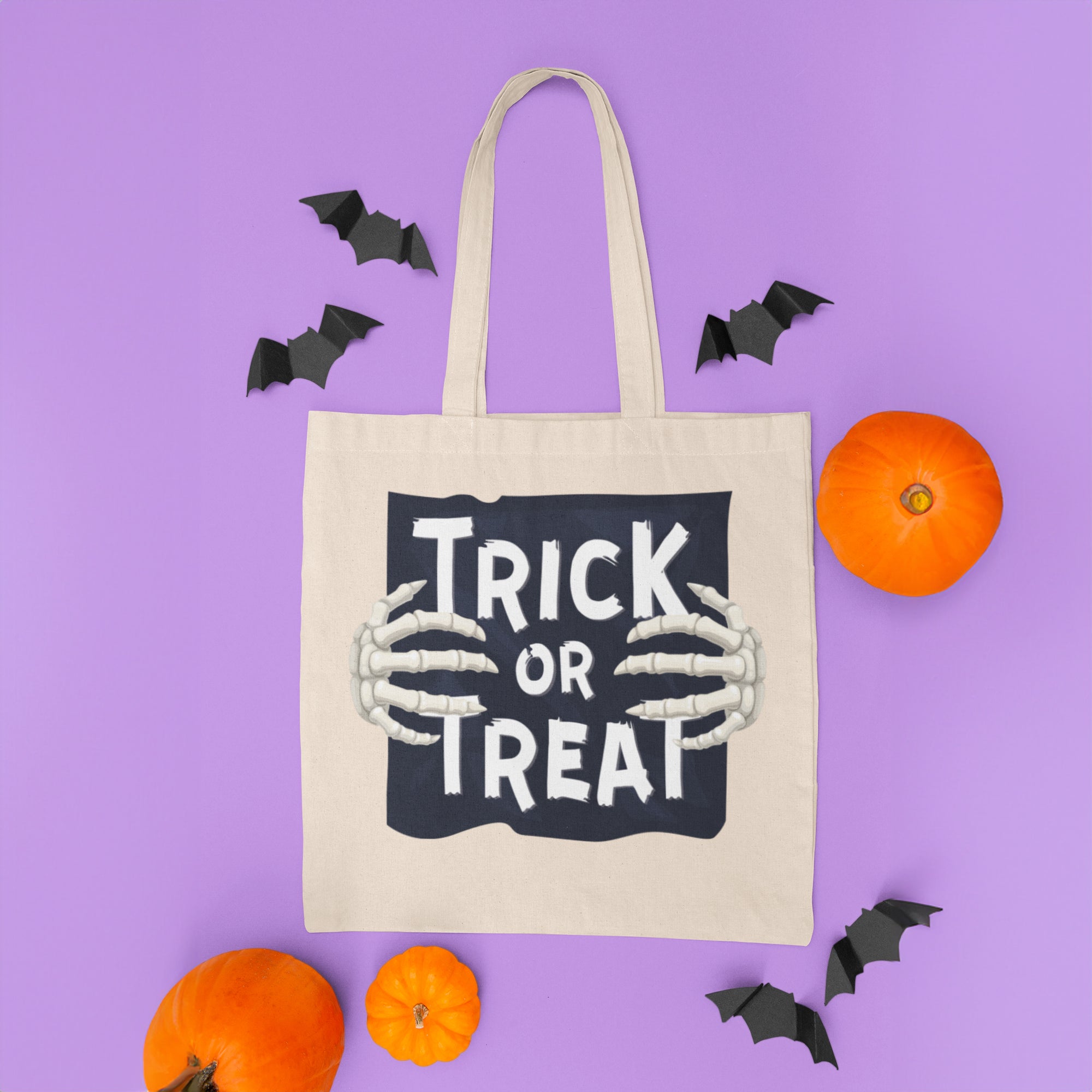 a trick or treat bag surrounded by bats and pumpkins