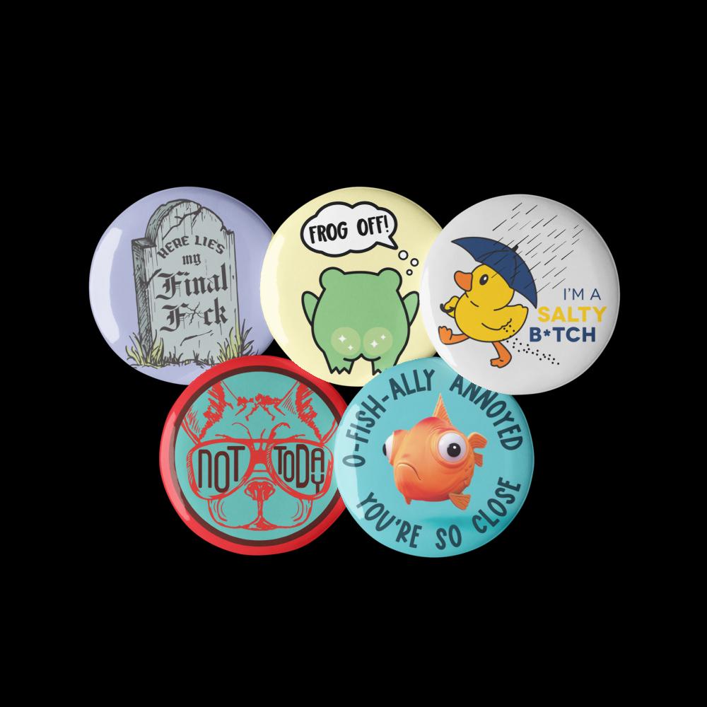 a collection of six circular buttons with various humorous and quirky designs.